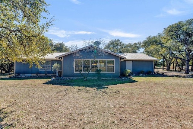 ranch-style house with a front lawn