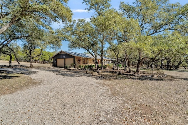 view of yard featuring a garage