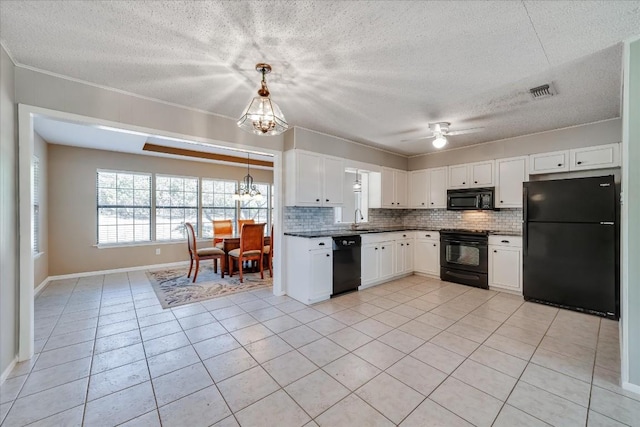 kitchen with sink, white cabinetry, decorative light fixtures, decorative backsplash, and black appliances