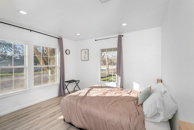 bedroom with light hardwood / wood-style floors