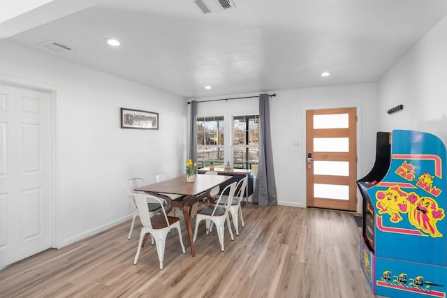 dining room with light hardwood / wood-style floors