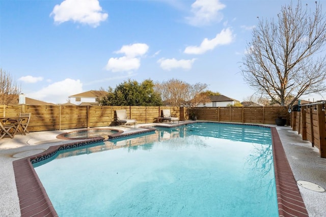 view of swimming pool featuring an in ground hot tub