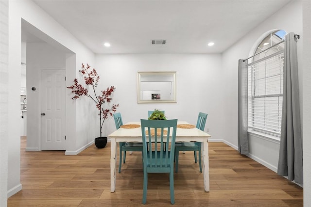 dining space featuring light wood-type flooring