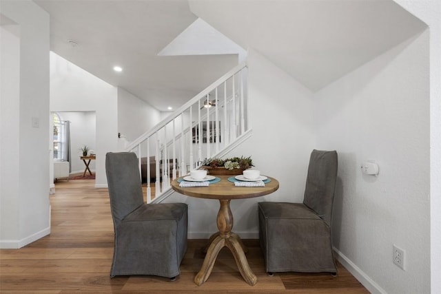 dining space featuring wood-type flooring