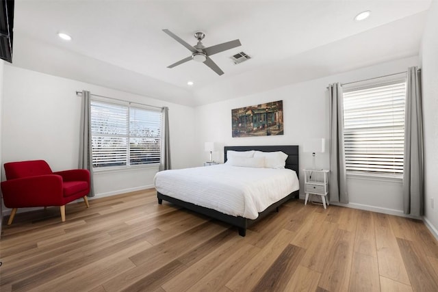 bedroom with ceiling fan and light wood-type flooring