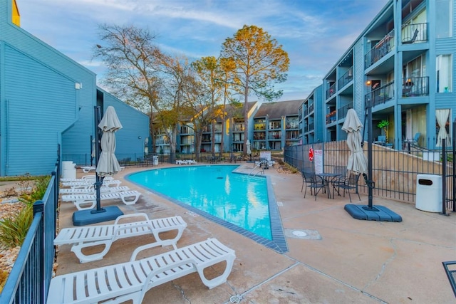 view of swimming pool with a patio