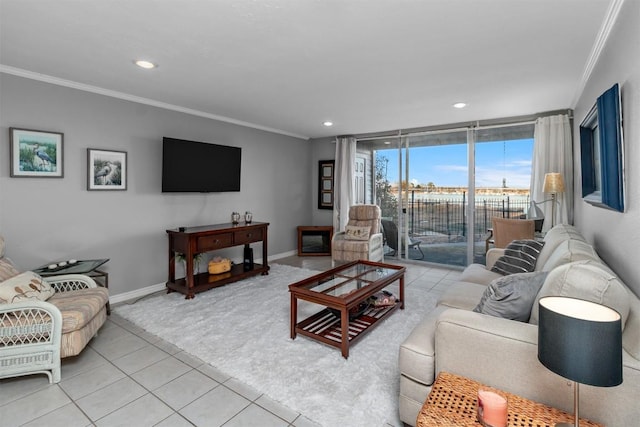 living room featuring light tile patterned floors, crown molding, and expansive windows