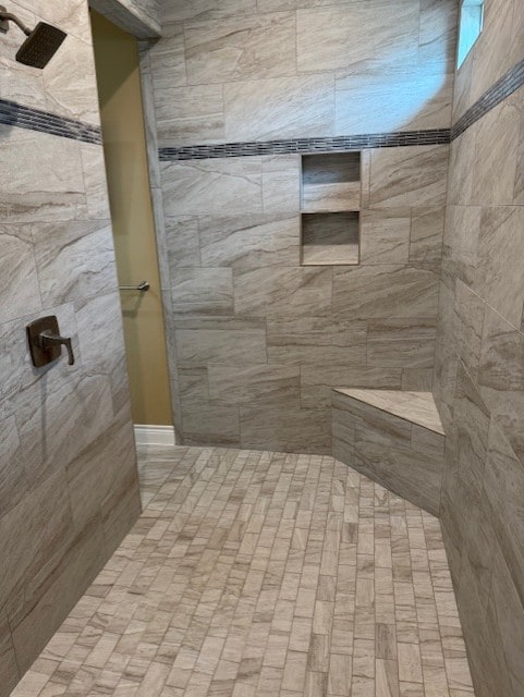 bathroom with tiled shower