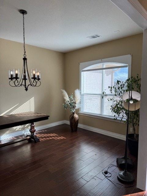 dining space with dark hardwood / wood-style floors