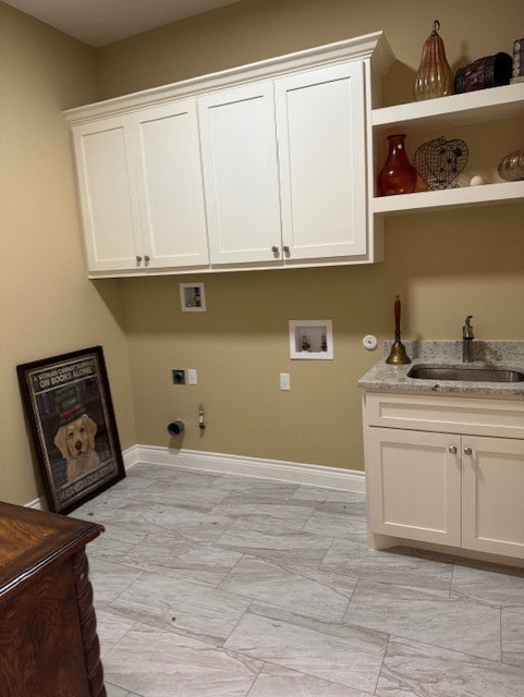 laundry area with gas dryer hookup, sink, cabinets, washer hookup, and electric dryer hookup