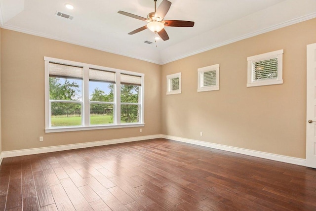 124 Abamillo Dr, Bastrop, TX 78602 - spare room featuring dark wood-type flooring, ceiling fan, and crown molding