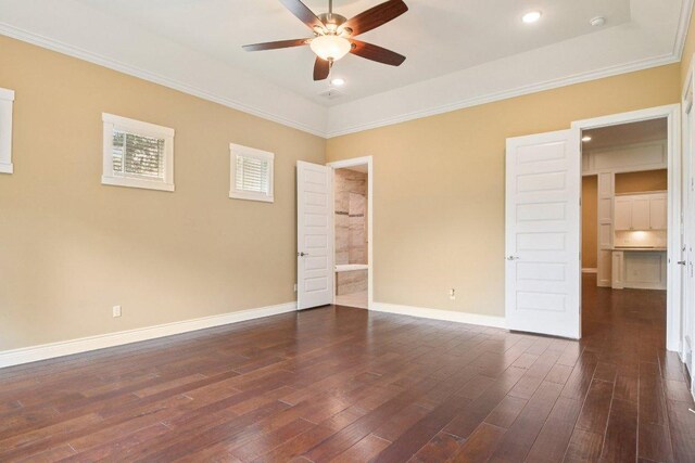 124 Abamillo Dr, Bastrop, TX 78602 - unfurnished bedroom featuring dark wood finished floors, ornamental molding, recessed lighting, ensuite bathroom, and ceiling fan