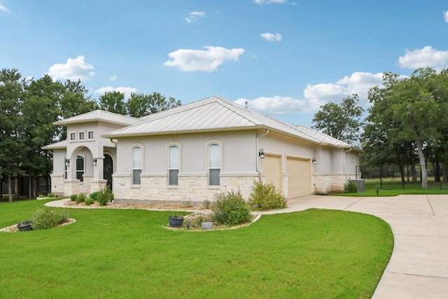 124 Abamillo Dr, Bastrop, TX 78602 - view of front of property featuring stucco siding, stone siding, driveway, a front yard, and an attached garage