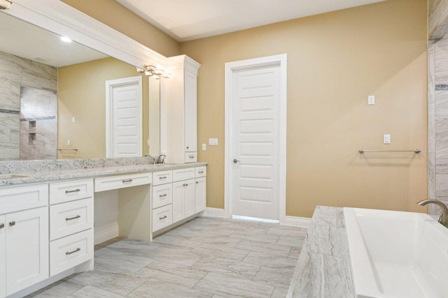 124 Abamillo Dr, Bastrop, TX 78602 - full bath with double vanity and a freestanding bath
