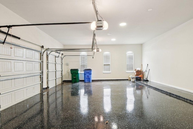 124 Abamillo Dr, Bastrop, TX 78602 - garage featuring a garage door opener and recessed lighting
