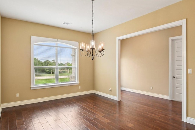 124 Abamillo Dr, Bastrop, TX 78602 - empty room featuring a chandelier and dark wood-style floors