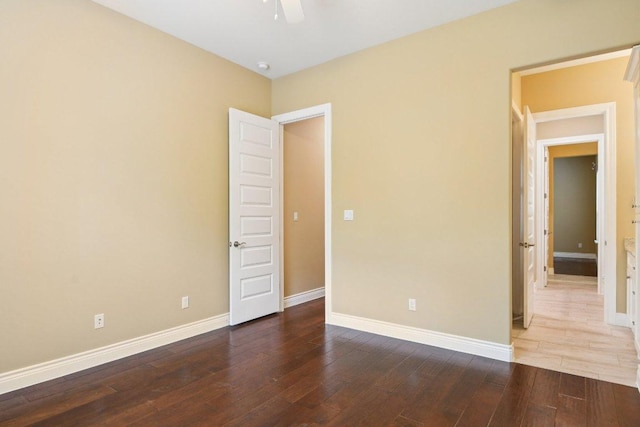 124 Abamillo Dr, Bastrop, TX 78602 - empty room with wood-type flooring, a ceiling fan, and a smoke detector