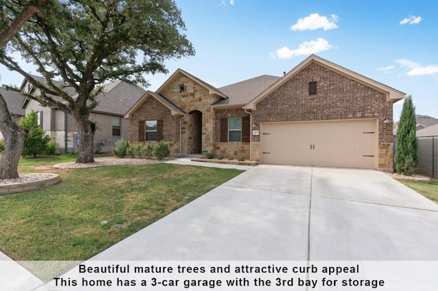 view of front of house featuring a garage and a front yard