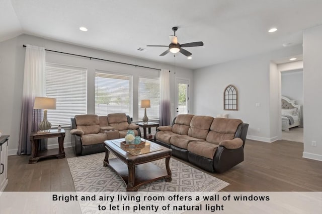 living room with hardwood / wood-style flooring and ceiling fan