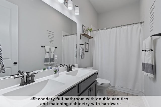 full bathroom featuring tile patterned flooring, vanity, toilet, and shower / tub combo with curtain