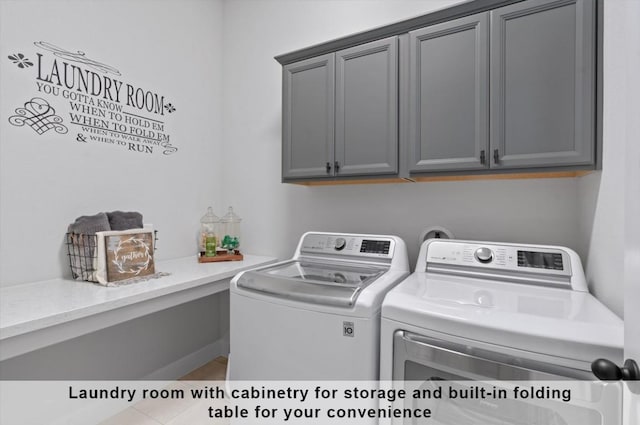 laundry room with cabinets and separate washer and dryer