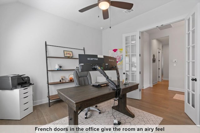 home office featuring light hardwood / wood-style flooring, french doors, and ceiling fan