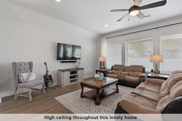 living room featuring hardwood / wood-style flooring and ceiling fan