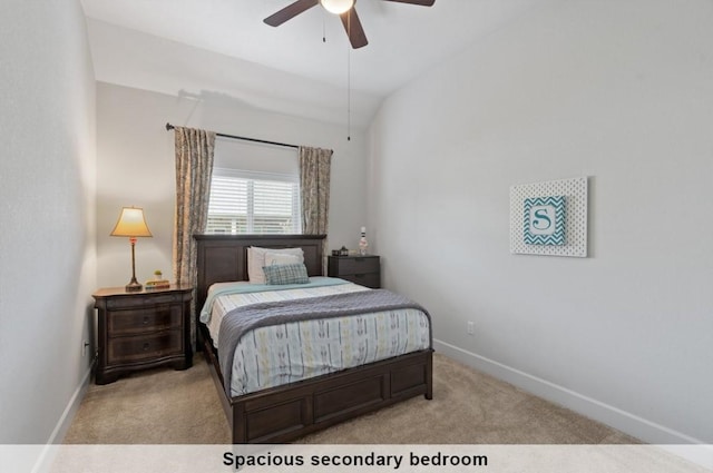 bedroom featuring light carpet, lofted ceiling, and ceiling fan