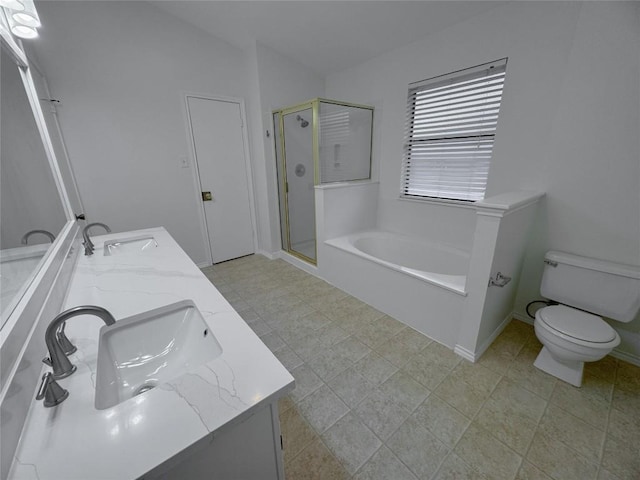 full bathroom featuring vanity, shower with separate bathtub, and toilet