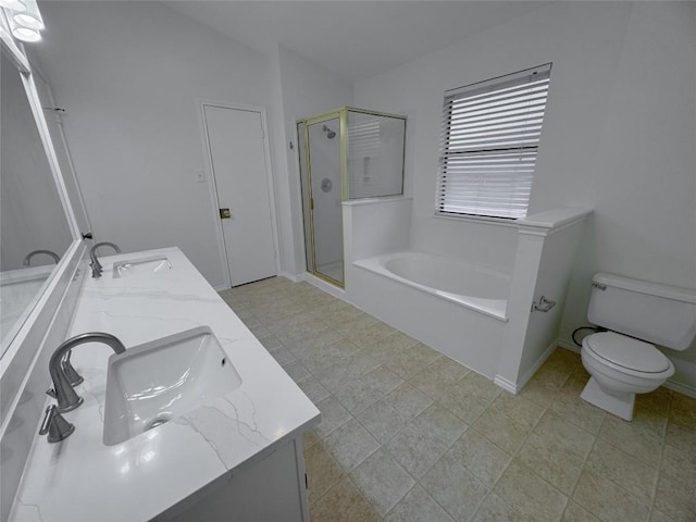 6507 Luckenbach Ln, Austin, TX 78729 - bathroom with a bath, a stall shower, double vanity, toilet, and baseboards