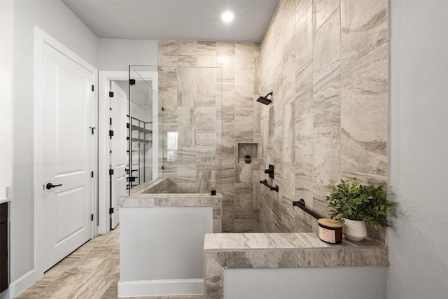 bathroom featuring walk in shower and recessed lighting