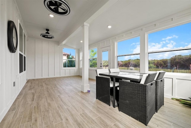 sunroom / solarium with beam ceiling