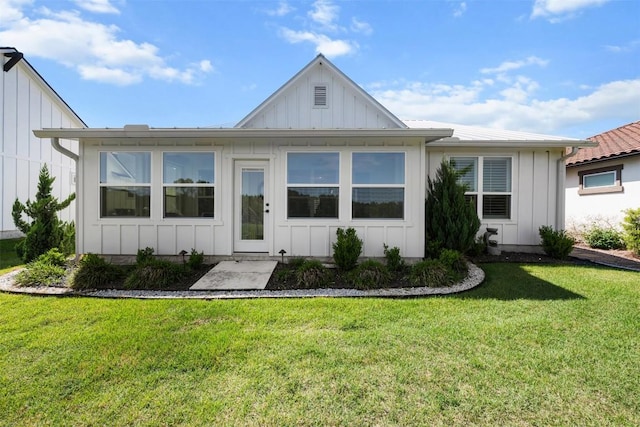 view of front of home featuring a front lawn and board and batten siding