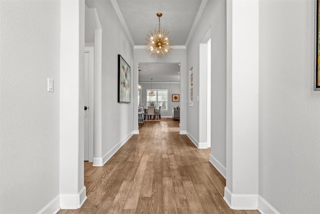 132 Drawing Maple St, San Marcos, TX 78666 - corridor featuring a chandelier, crown molding, and wood finished floors