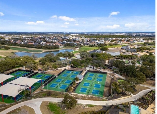 bird's eye view with a water view and a residential view