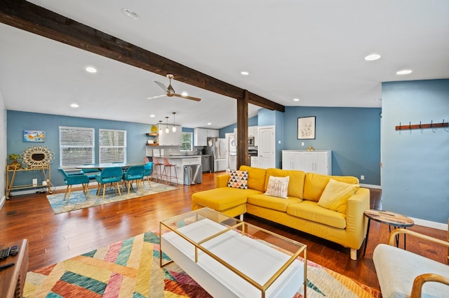 living room featuring hardwood / wood-style flooring, ceiling fan, and vaulted ceiling with beams