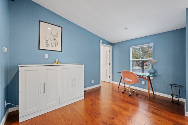 office space featuring hardwood / wood-style flooring and lofted ceiling