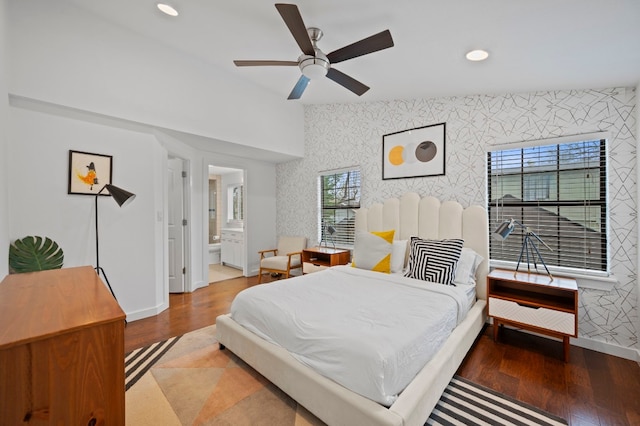 bedroom featuring ceiling fan, ensuite bath, and wood-type flooring