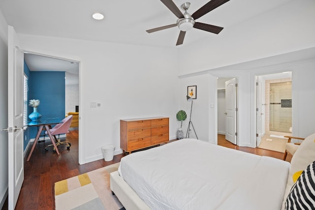 bedroom featuring dark hardwood / wood-style flooring, ceiling fan, and ensuite bathroom