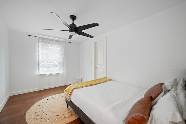 bedroom featuring ceiling fan and dark hardwood / wood-style floors