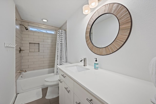 full bathroom with vanity, toilet, and shower / tub combo