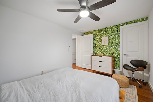 bedroom featuring wood-type flooring and ceiling fan