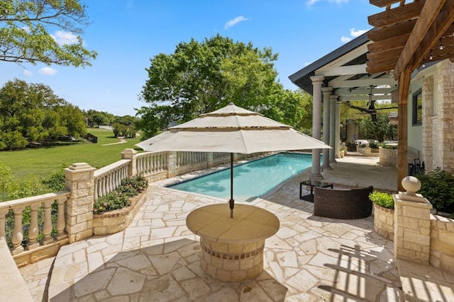 view of swimming pool with a patio, a yard, and a pergola