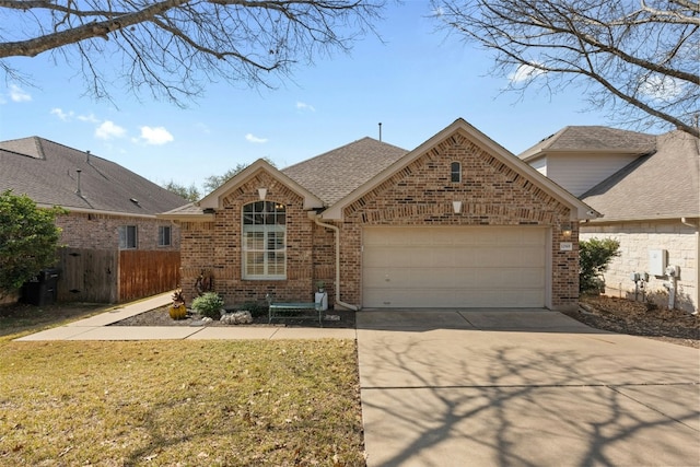 view of front of property with a garage and a front lawn