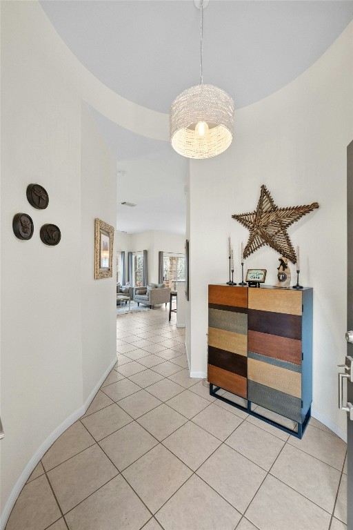 hallway with light tile patterned floors