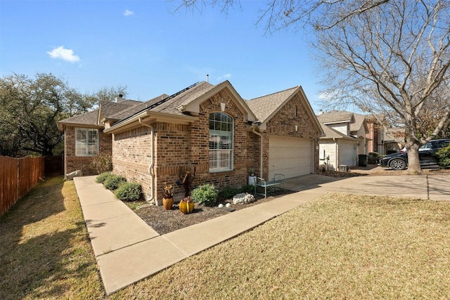 view of front facade with a garage and a front yard