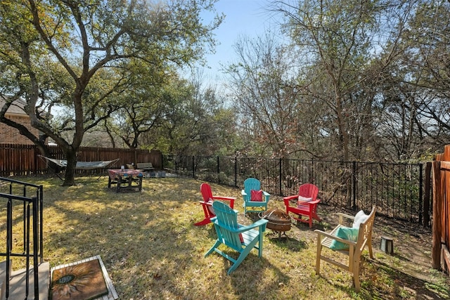 view of yard featuring an outdoor fire pit