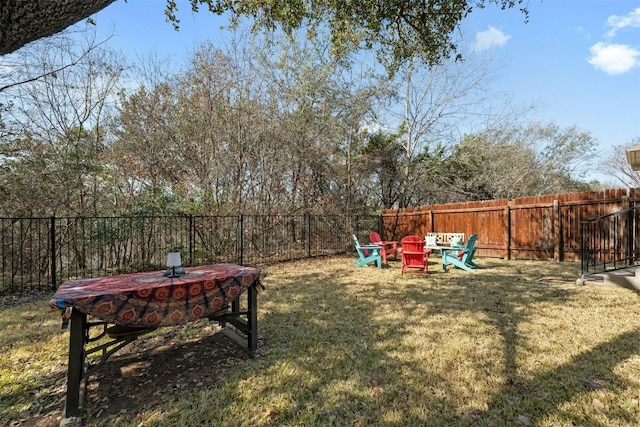 view of yard with a fire pit