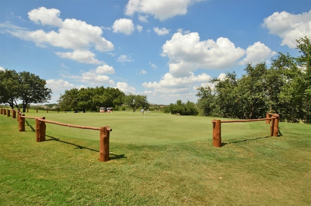 surrounding community featuring a yard