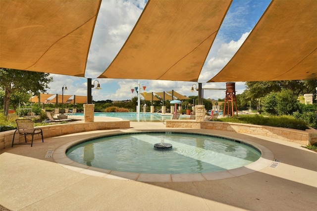 view of pool featuring a playground